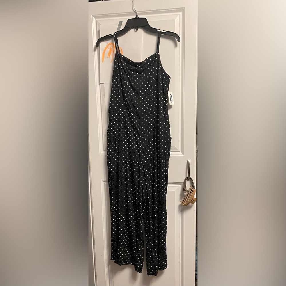 Old navy, navy blue jumpsuit with white polka dots.